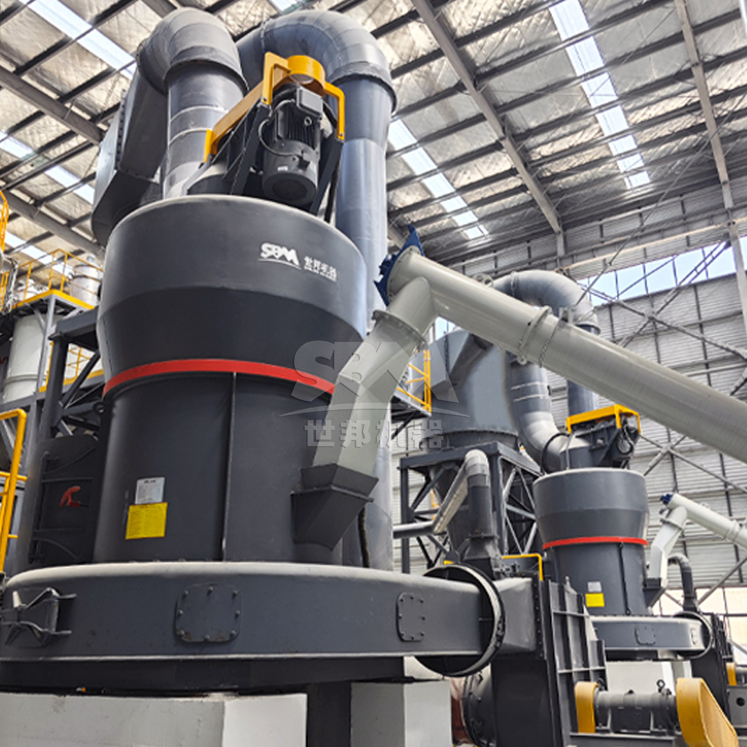 An operator monitoring a control panel for a modern grinding mill system, ensuring optimal performance.