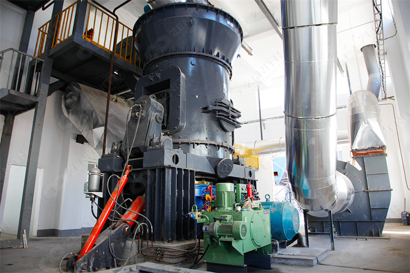 Industrial grinding mill in operation processing mineral ores